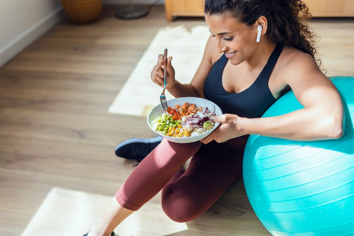 A person enjoying a fresh pescatarian bowl